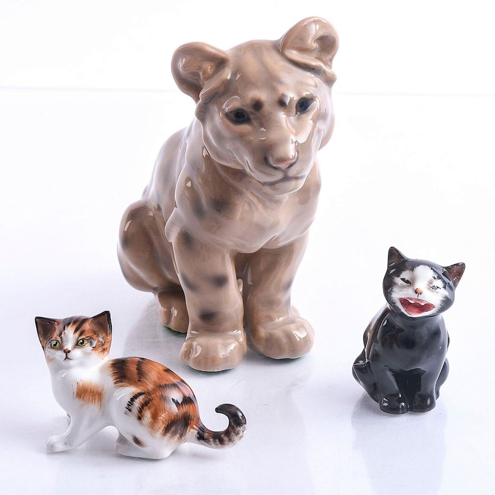 Appraisal: PORCELAIN CAT FIGURINES Bing and Grondahl tiger cub Royal Doulton