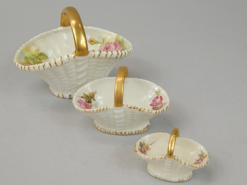 Appraisal: An associated set of three Royal Worcester porcelain baskets each