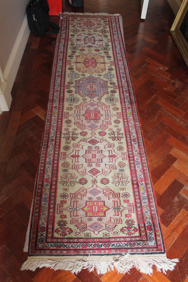 Appraisal: A pale green ground carpet runner cm x cm