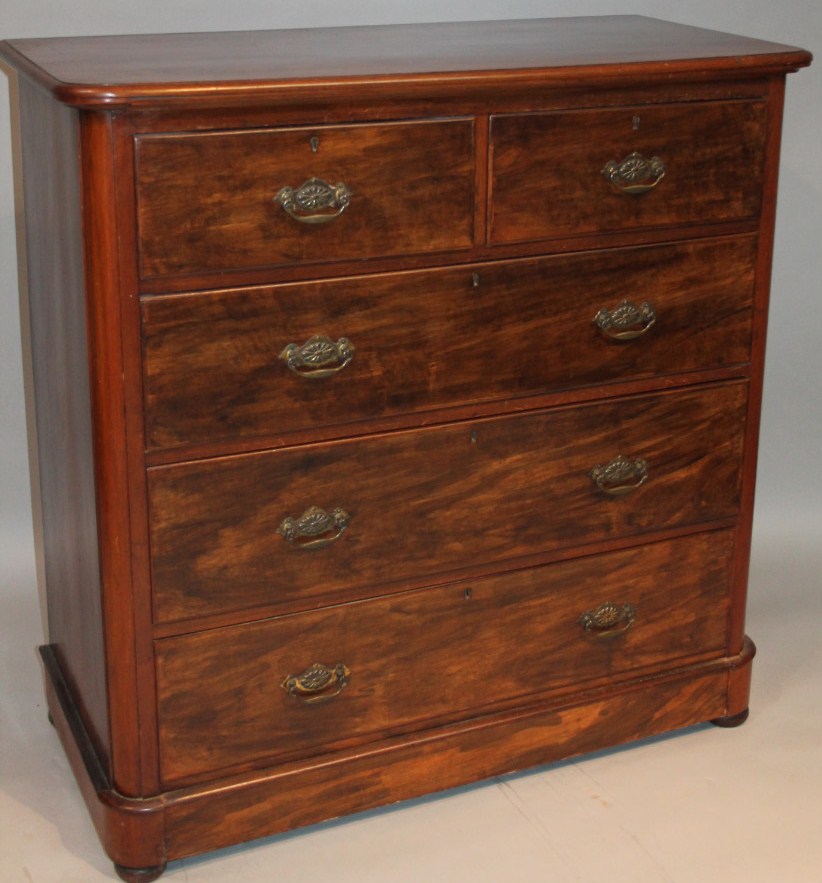 Appraisal: A late Victorian stained mahogany chest the overhanging moulded top