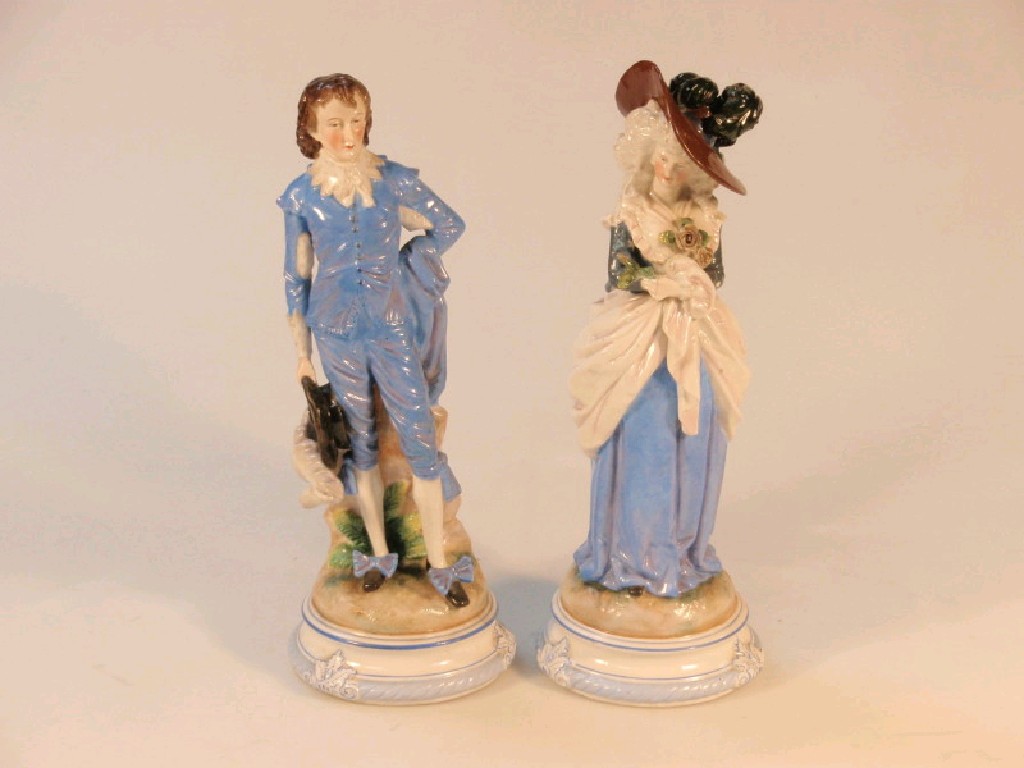 Appraisal: A pair of thC continental glazed bisque porcelain figures in