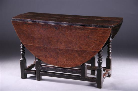 Appraisal: ENGLISH BAROQUE STYLE OAK GATE-LEG TABLE th century Plank top