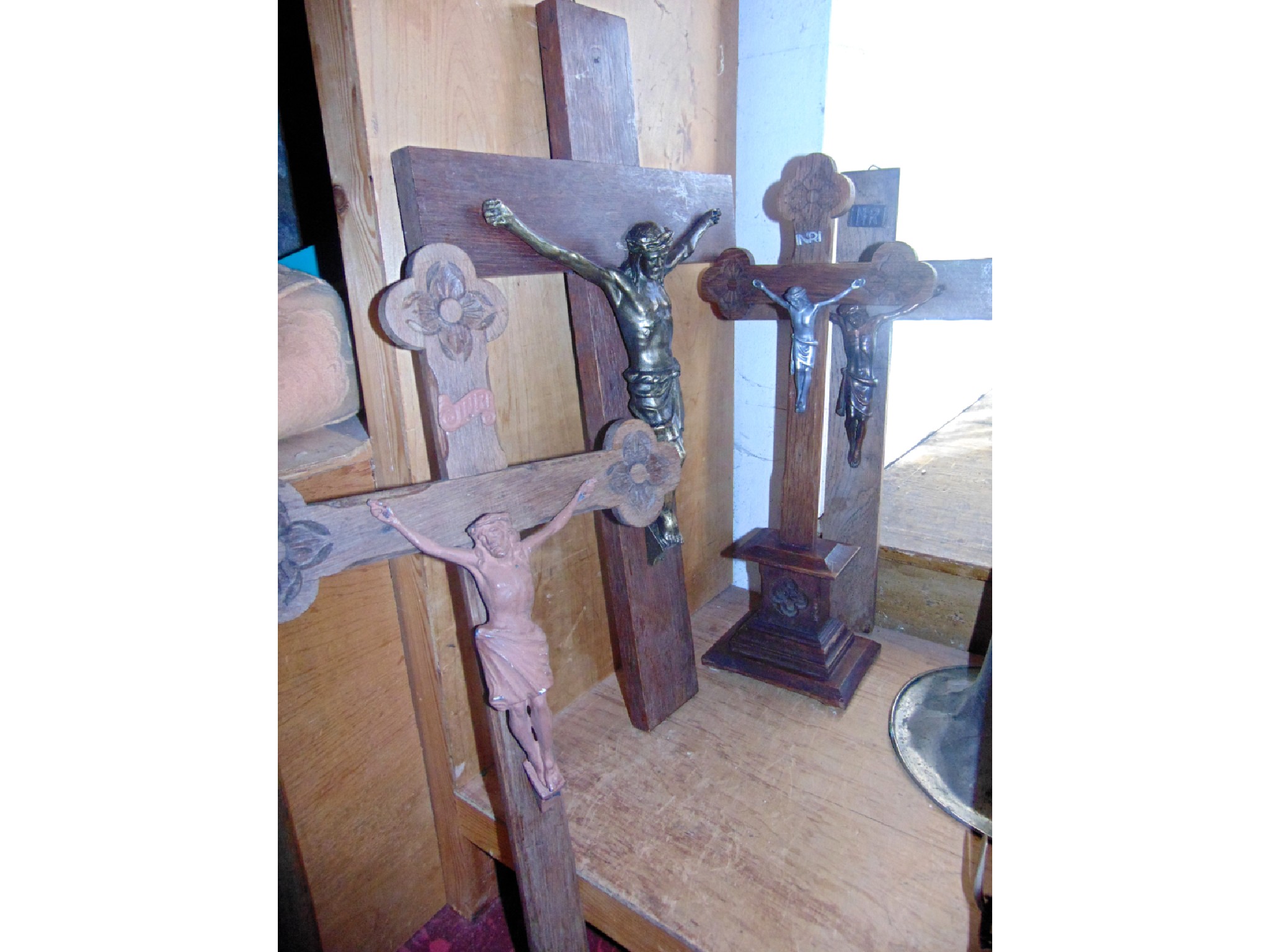 Appraisal: A trio of large wall hanging crucifix to include one