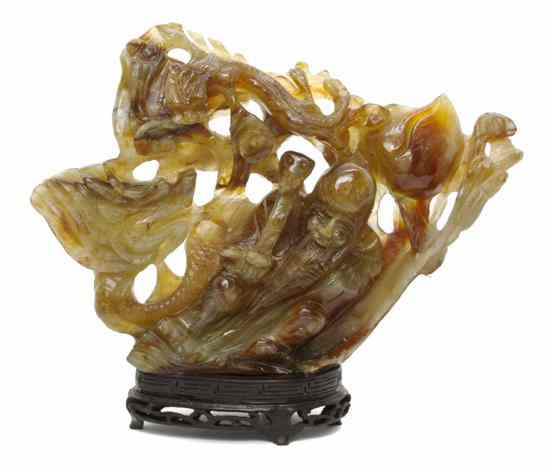 Appraisal: A Chinese Carved Hardstone Figure the brown yellow and green