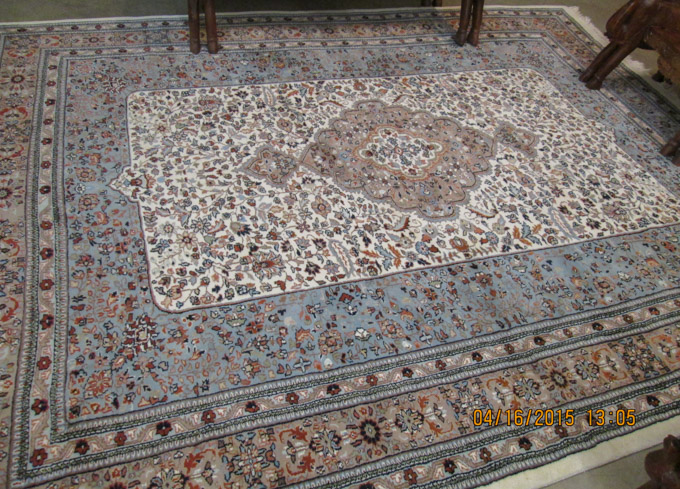 Appraisal: HAND KNOTTED ORIENTAL CARPET Indo-Persian floral and central floral medallion