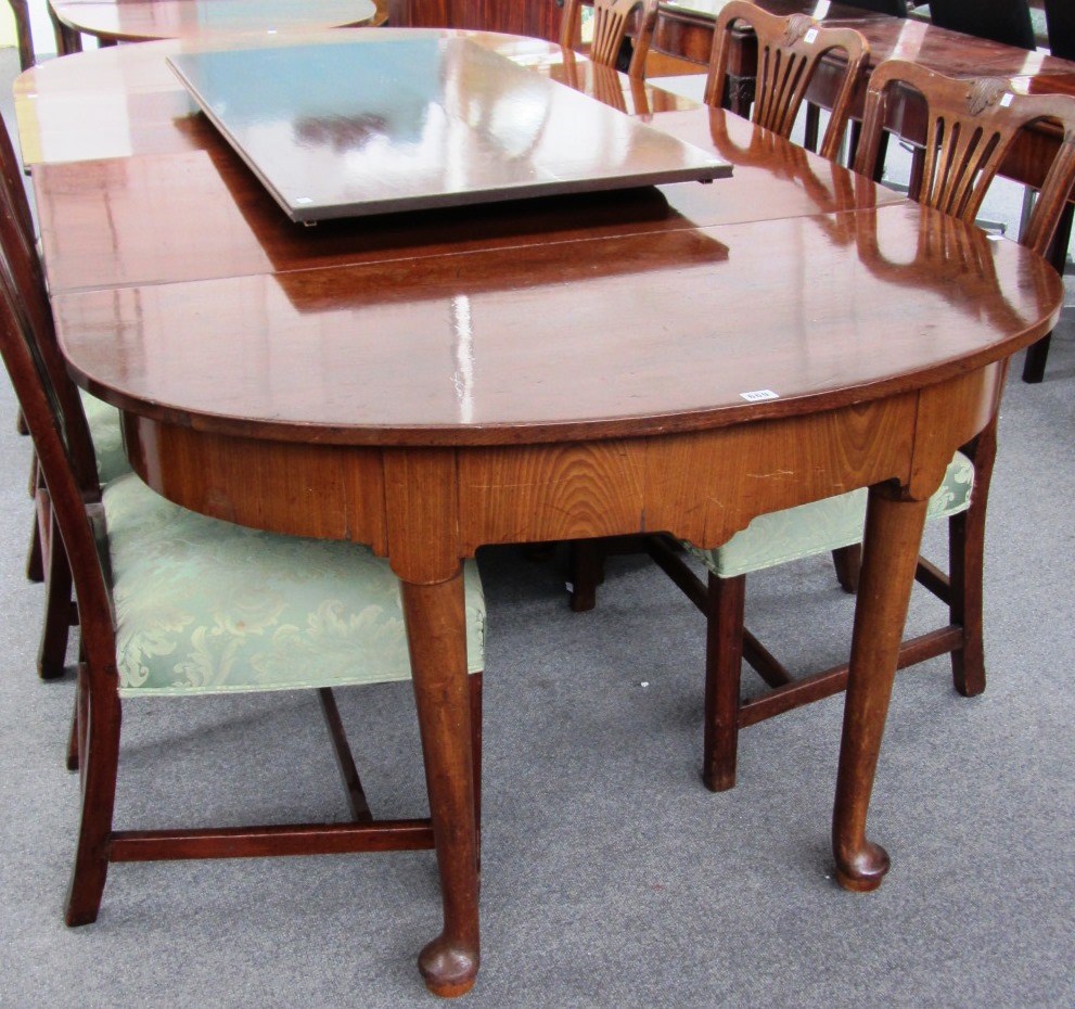 Appraisal: A George III mahogany dining table with a pair of