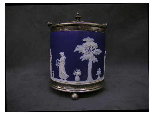 Appraisal: Blue and white Jasperware biscuit jar in silver plate frame