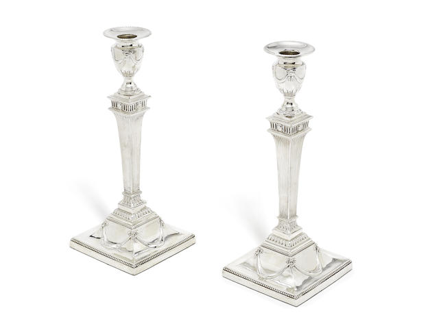 Appraisal: A pair of George III silver candlesticks by Robert Jones