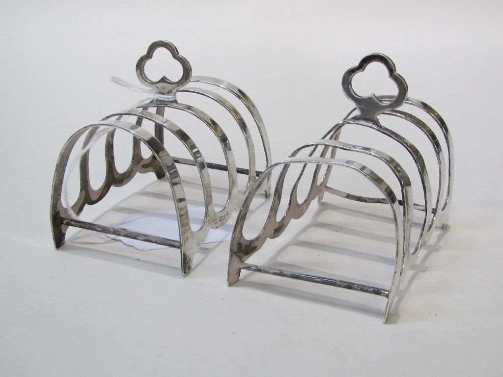 Appraisal: Pair of silver toast racks Birmingham marks