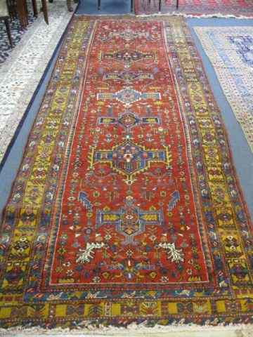 Appraisal: Heriz Persian Handmade Rug interesting geometrics stylized florals red field