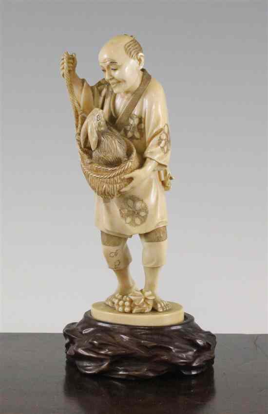 Appraisal: A Japanese ivory figure Meiji period - carved as a