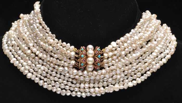 Appraisal: SEVEN-STRAND SEED PEARL NECKLACE With gold gem and pearl clasp