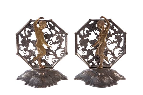 Appraisal: A pair of Oscar Bach patinated and gilt metal figural