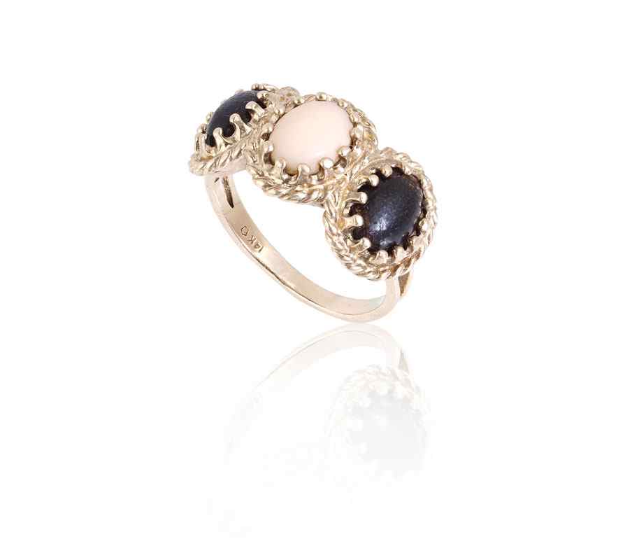 Appraisal: BLACK AND PINK CORAL RING K yellow gold ring contains