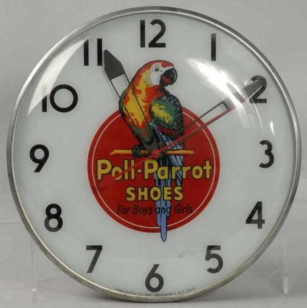 Appraisal: Polly Parrot Shoes Advertising Light-Up Clock Description Manufactured by Pam