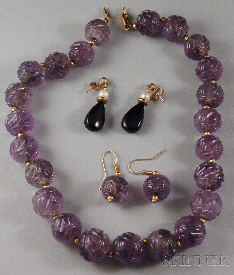 Appraisal: Carved Amethyst Bead Necklace and Earpendants composed of carved amethyst