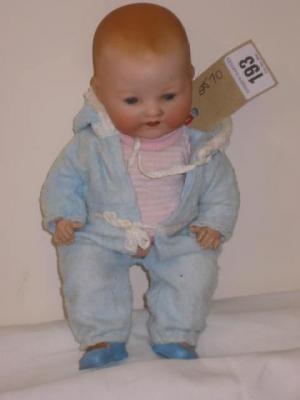 Appraisal: An Armand Marseille bisque head baby doll with blue glass