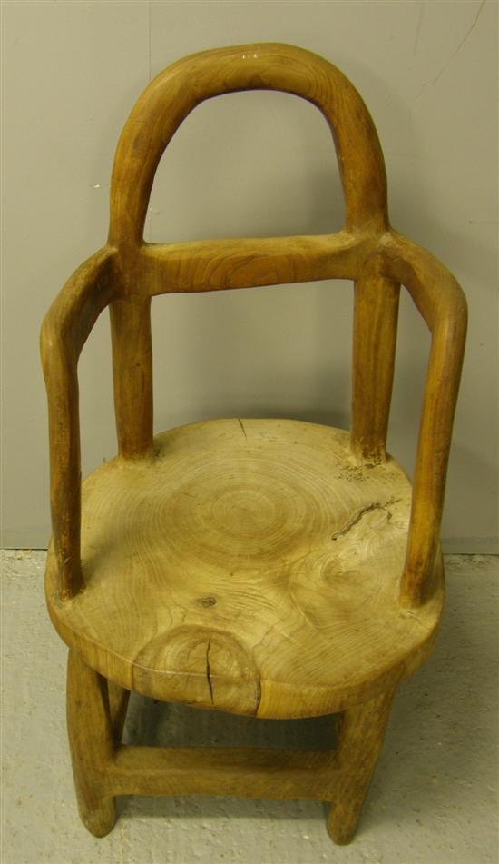 Appraisal: Solid elm chair carved out of a single piece of