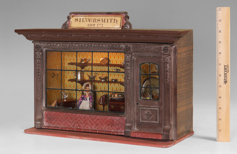 Appraisal: OLD SILVERSMITH SHOP DIORAMA WITH MINIATURE STERLING HOLLOWARE Miniatures include