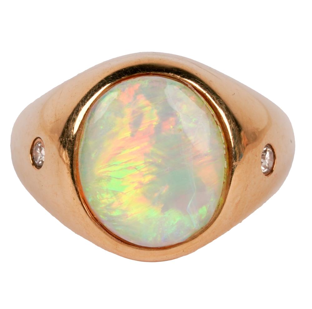 Appraisal: KARAT YELLOW GOLD OPAL DIAMOND RINGcentering one oval cabochon-cut opal