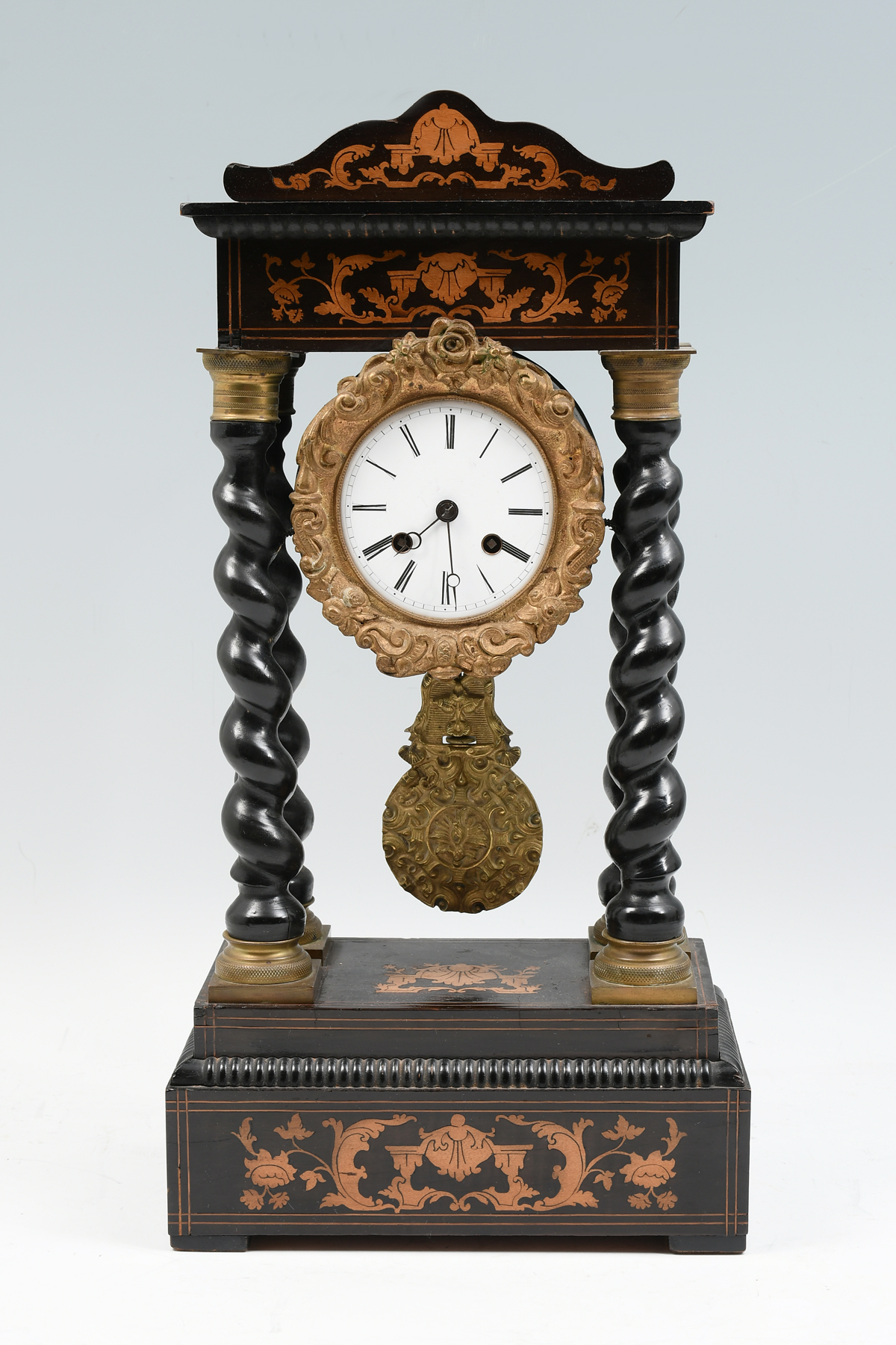 Appraisal: INLAID BARLEY TWIST PORTICO CLOCK Late th-century french ebonized Portico