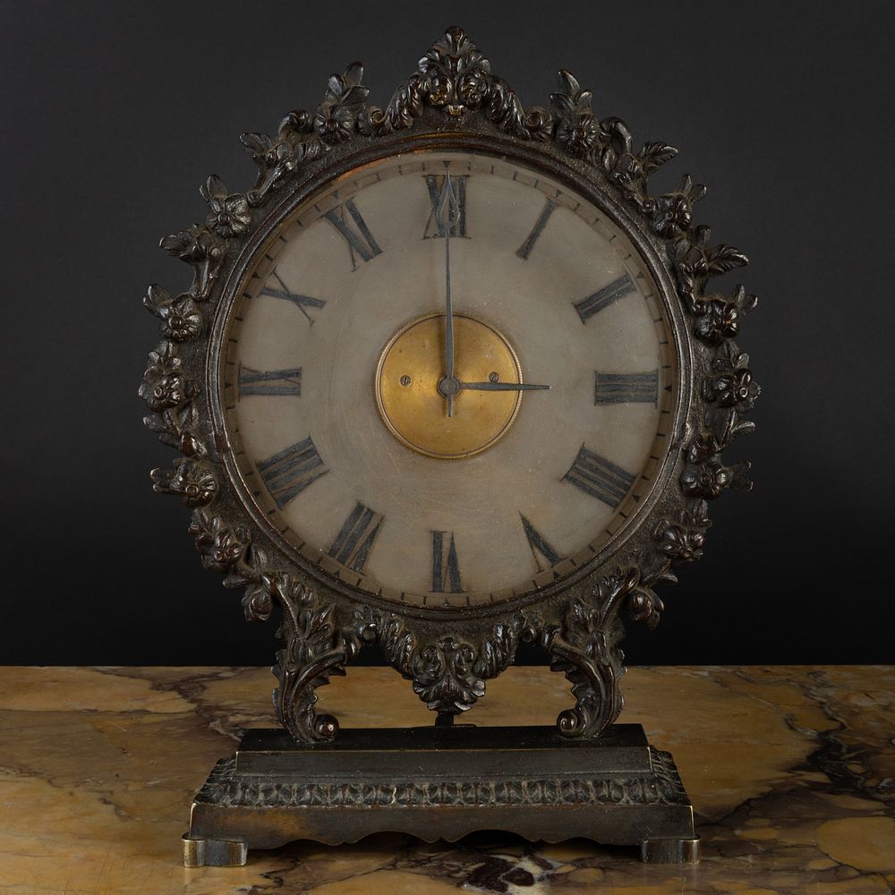 Appraisal: Continental Bronze and Glass Illuminating Clock Fitted with a candle