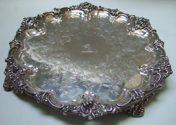 Appraisal: A Victorian silver shaped circular salver the rim with floral