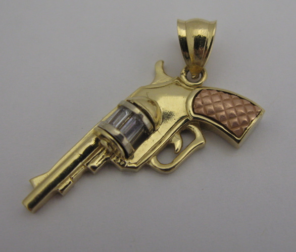 Appraisal: FOURTEEN KARAT YELLOW AND ROSE GOLD PISTOL PENDANT in length