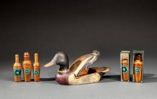 Appraisal: Mallard Tobacco Box and Game Calls Carl Malmstrom - Long