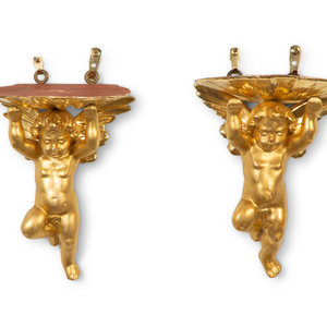 Appraisal: A Pair of Carved Giltwood Putti Wall Brackets th Century