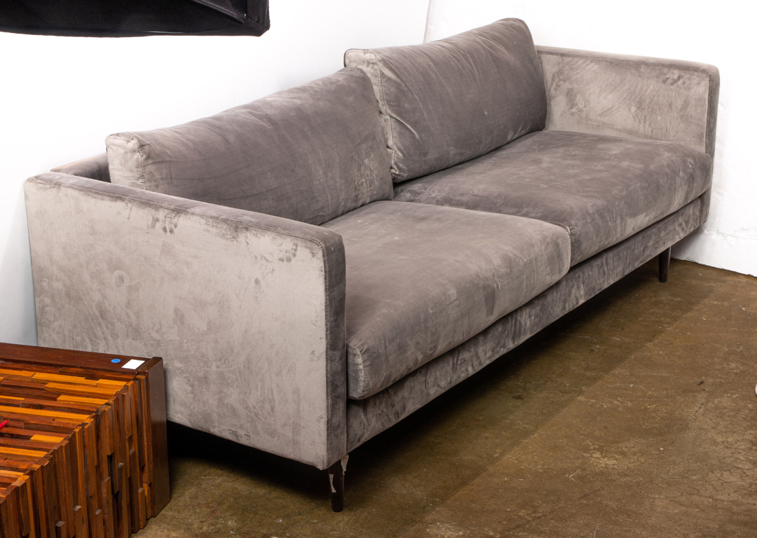 Appraisal: A CONTEMPORARY TWO SEAT SUEDE SOFA A Contemporary two seat