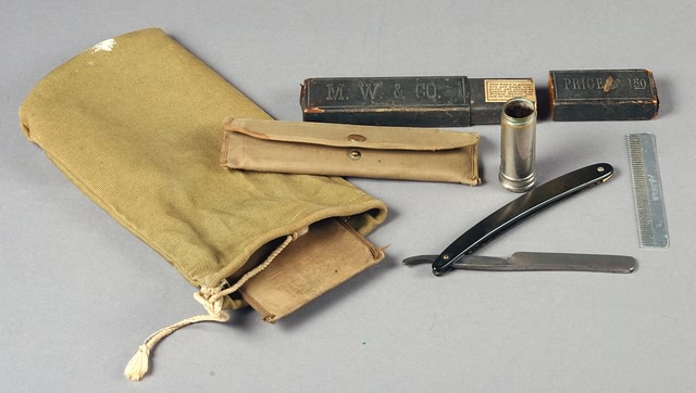 Appraisal: WWI Khaki Ditty Bag with shaving brush razor honing stone