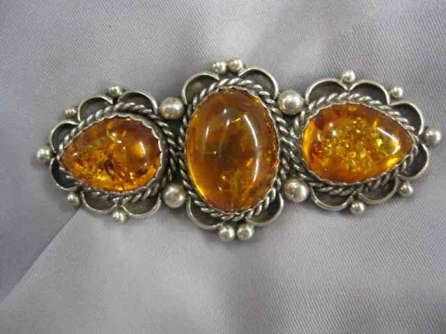 Appraisal: Amber Brooch trio of golden cabachons '' wide sterling