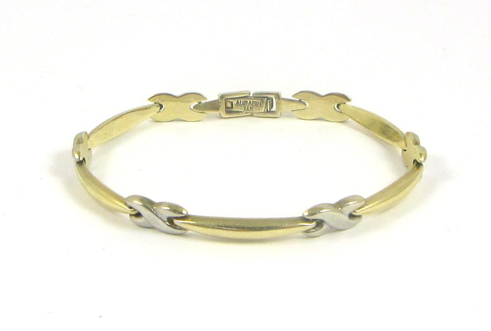 Appraisal: CONTEMPORARY FOURTEEN KARAT GOLD LINK BRACELET alternating white X and