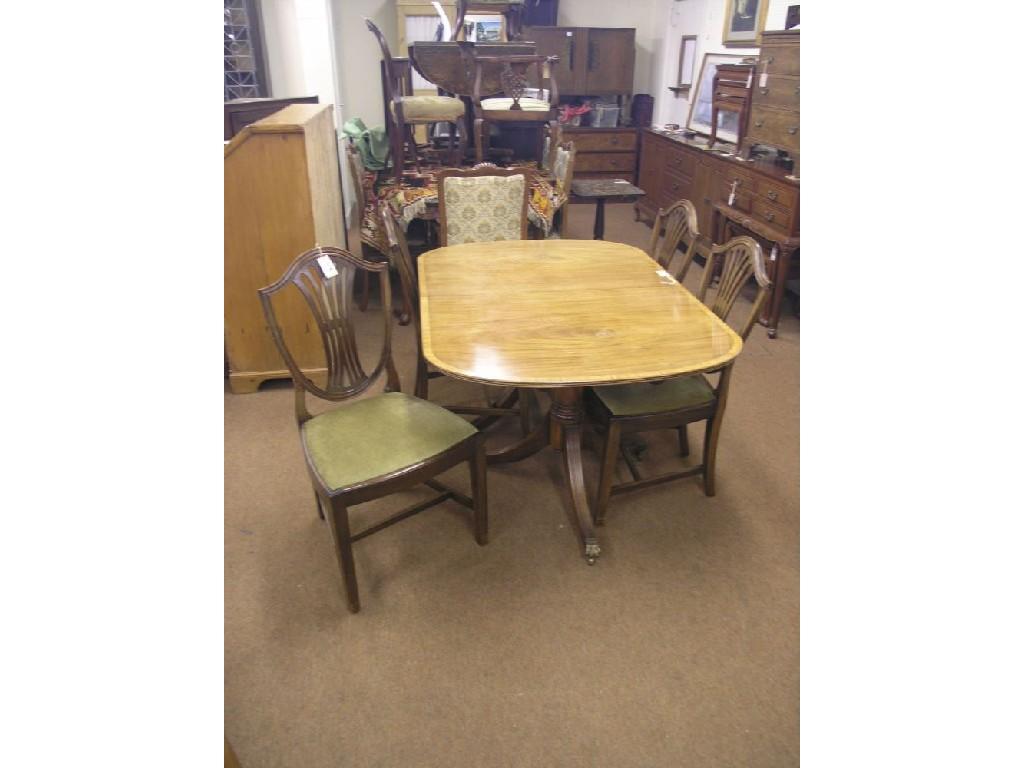 Appraisal: A George III-style mahogany D-end dining table with extra leaf