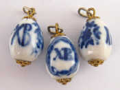 Appraisal: Three Russian porcelain miniature Easter eggs with blue underglaze decoration