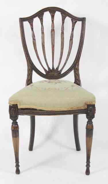 Appraisal: A th Century mahogany shield back chair with upholstered seat