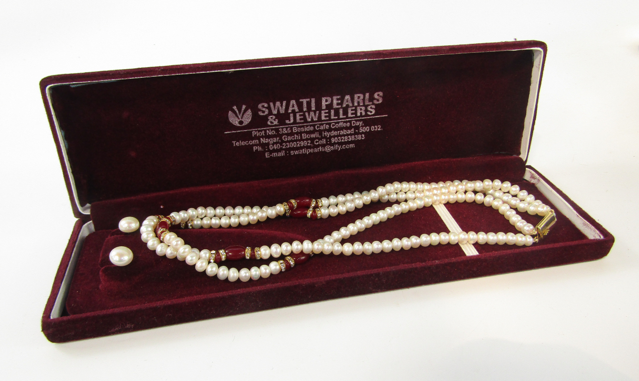 Appraisal: A Swati of Hyderabad double strand of cultured pearls with