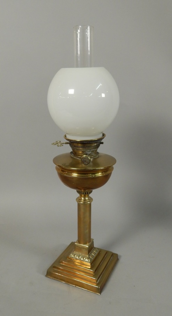 Appraisal: A brass column style oil lamp on a stepped base