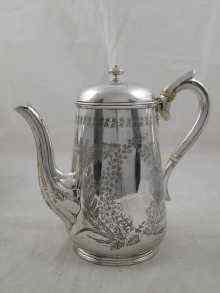 Appraisal: A Victorian silver coffee pot hot water jug with bright