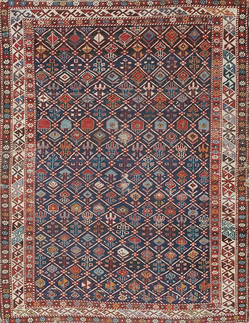 Appraisal: A SHIRVAN BLUE GROUND RUG with a stylistic latticework design