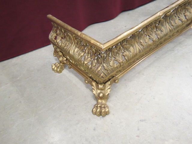 Appraisal: Ornate Victorian Brass Fireplace Fender leaf designs with large lion