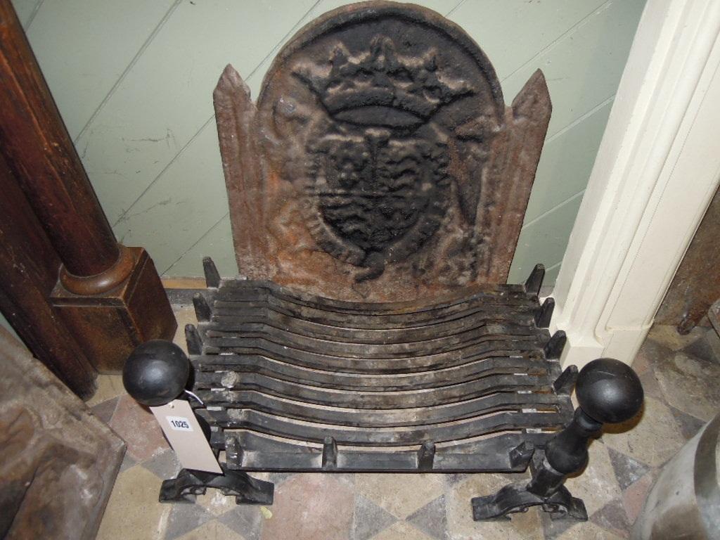 Appraisal: A heavy cast iron fire grate and matching dogs with