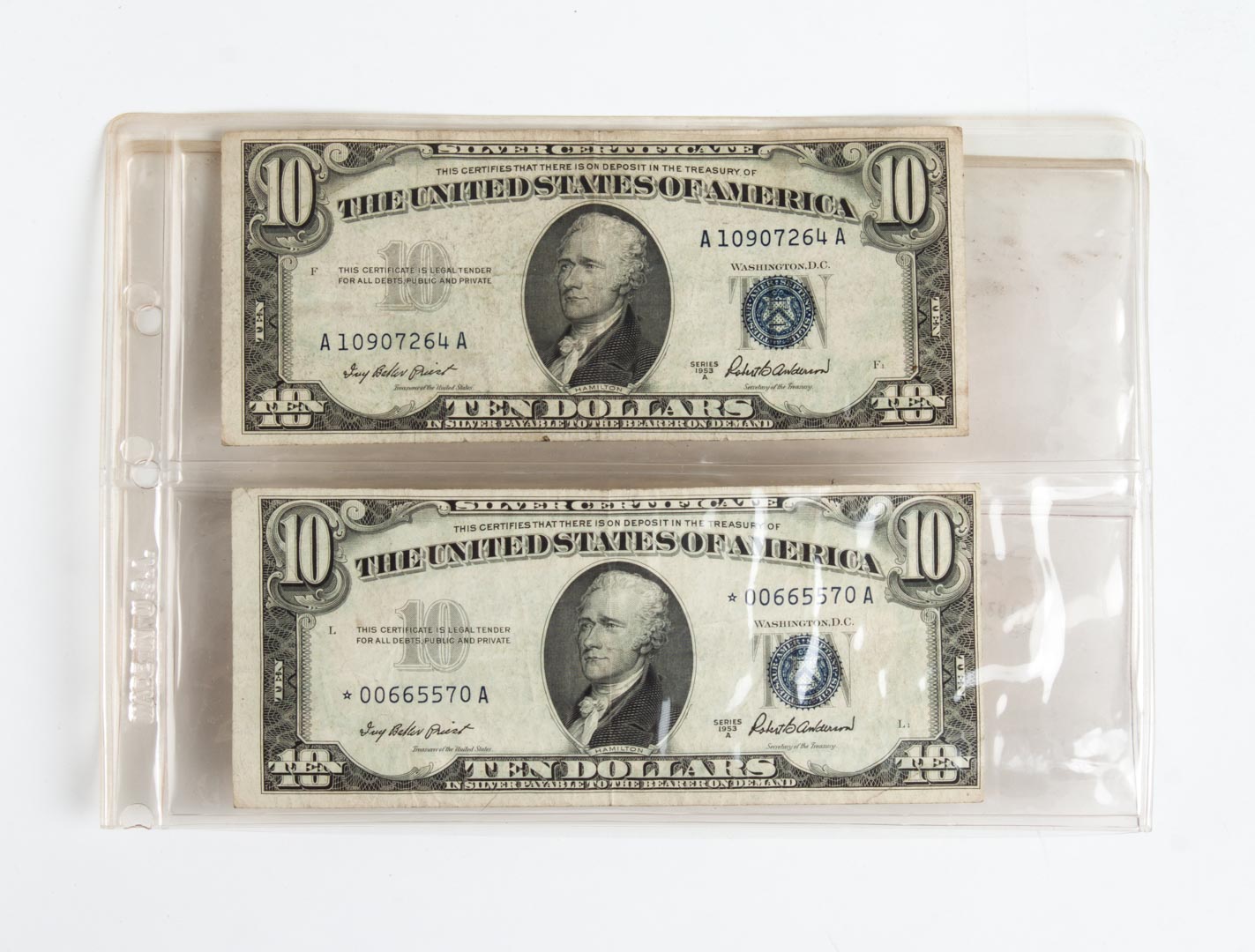 Appraisal: Two U S silver certificates A both cut off-center one