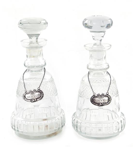 Appraisal: Near pair English crystal decanters with sterling labels circa cut-work