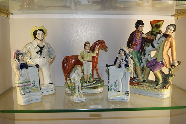 Appraisal: A STAFFORDSHIRE POTTERY MODEL HORSE with groom cm a Staffordshire