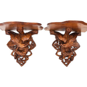 Appraisal: A Pair of Black Forest Style Carved Oak Wall Brackets