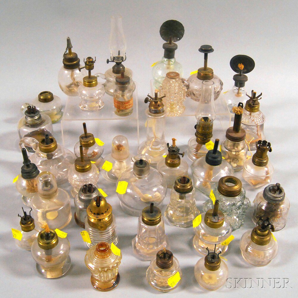 Appraisal: Group of Small Colorless Pressed Glass Fluid Burning Lamps ht