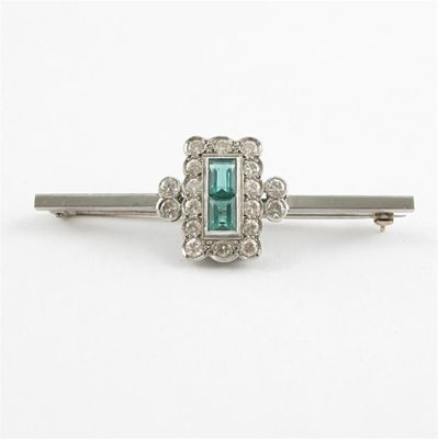 Appraisal: An emerald and diamond set bar brooch The two baguette