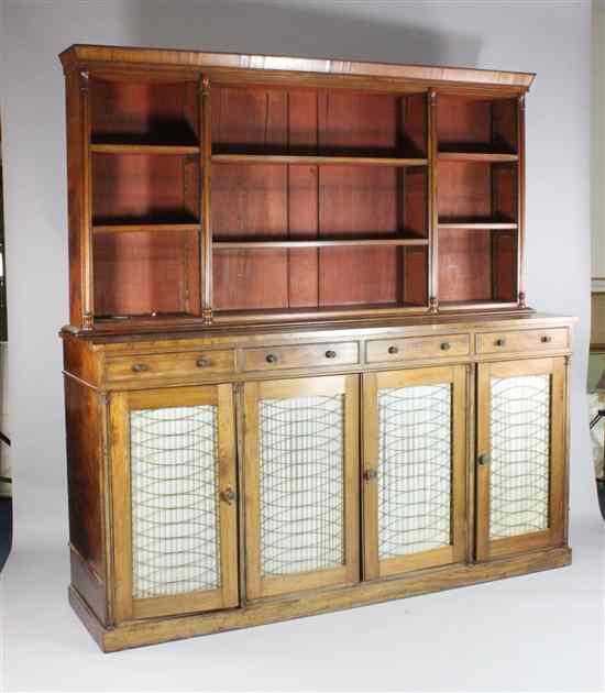 Appraisal: A Regency mahogany bookcase with adjustable shelves over four short